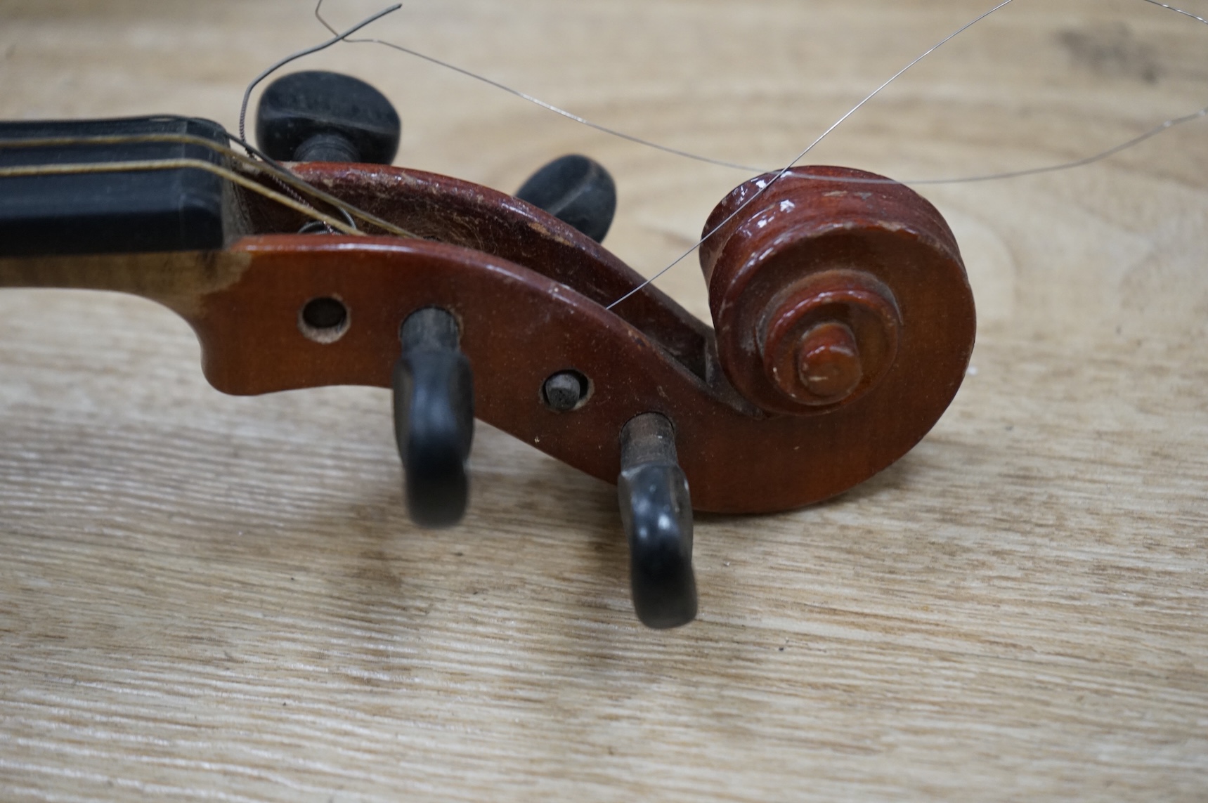 An early 20th century German violin, bearing a Stradivarius label, with case.
